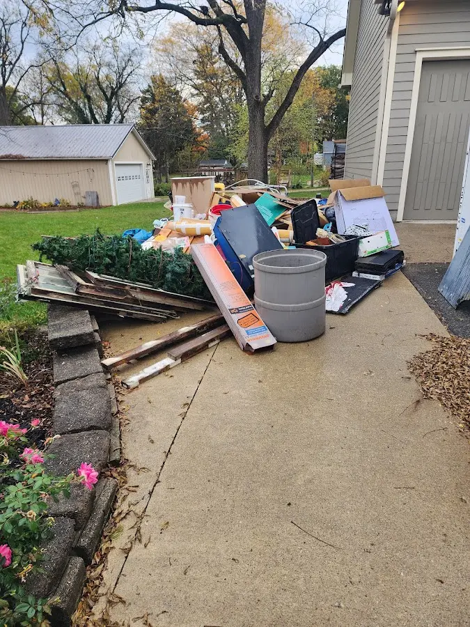 Dumpster being loaded with debris for Commercial Dumpster Rental in Wyandotte